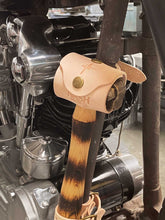 Nash X Mamoa Knucklehead Hammer mounted to motorcycle frame with natural leather hammer hanger